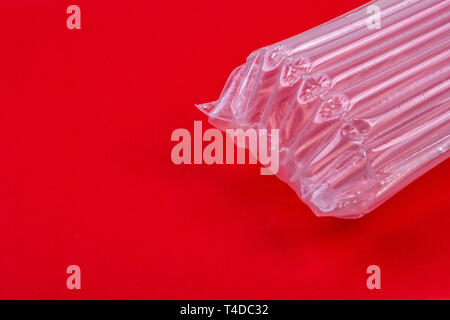 Plastic packaging with air cushion on red background Stock Photo