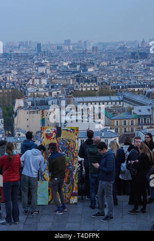 Street painter making an artwork with Fire burning at Notre Dame Cathedral in Paris, France Stock Photo