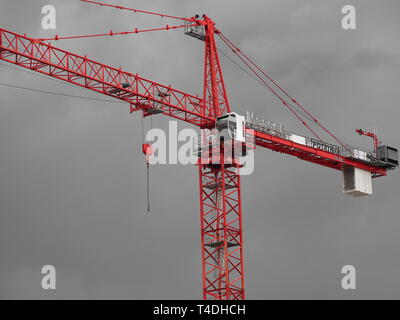 Construction tower crane with stormy sky in the back ground Stock