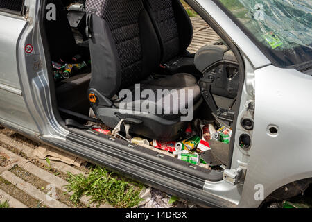 Abandoned Audi A3 car full of trash Stock Photo