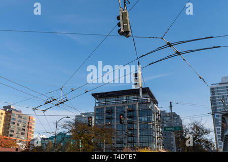 Tangle of cables and power lines for Seattle traffic signs and trams. Stock Photo