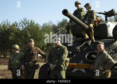 Polish WWII Big Red 1, 1st Infantry Division, Reenactors pose during a commemoration the 75th anniversary of the ‘great escape’ from the Stalag Luft III POW camp here on March 23-24, 2019. Stock Photo