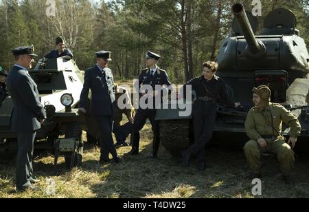 Polish WWII Reenactors, portraying American servicemen, perform during a commemoration event for the 75th anniversary of the ‘great escape’ from the Stalag Luft III POW camp here on March 23-24, 2019. Stock Photo