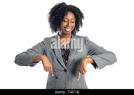 Black African American female businesswoman isolated on a white background advertising and pointing down Stock Photo