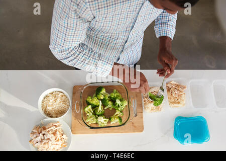 Overhead View Of Man In Kitchen Preparing High Protein Meal Stock Photo