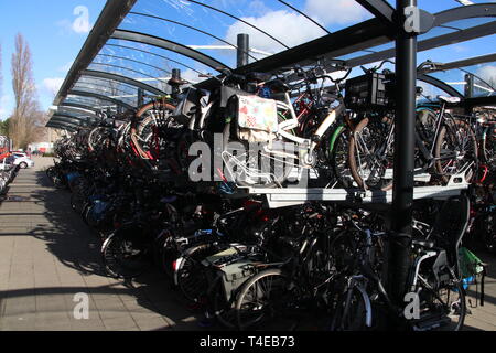 Two level storages for bicycles at railway and tram station Den Haag Laan van NOI in the Netherlands. Stock Photo