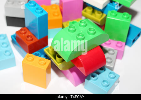 Construction designer for children. Building blocks. Multi-colored cubes for children. Teaching children. Geometry study. Stock Photo