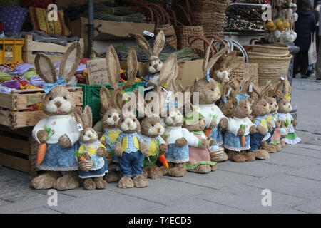 Funny row of easter bunnies in bavarian style looking into camera Stock Photo