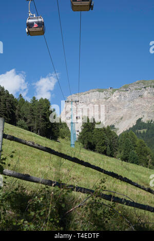 The Seceda Gondola traveling along The Val D'Anna or Annatal from Ortisei to Seceda Val Gardena Dolomites South Tyrol Italy. Stock Photo