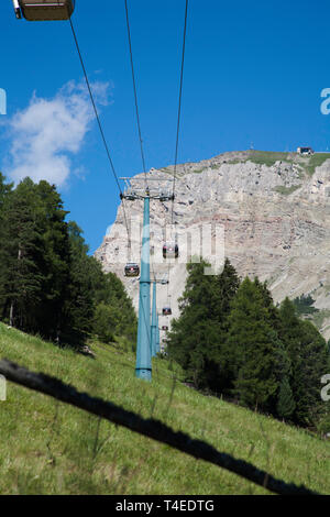 The Seceda Gondola traveling along The Val D'Anna or Annatal from Ortisei to Seceda Val Gardena Dolomites South Tyrol Italy. Stock Photo