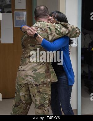 Rita Ibanez hugs Air Force Maj. (Dr.) Matthew Read, acting Extracorporeal Membrane Oxygenation medical director, at Brooke Army Medical Center, Fort Sam Houston, Texas, March 22, 2019. Ibanez met with Read and other members of the ECMO team to thank them for the care she received in 2015. Stock Photo