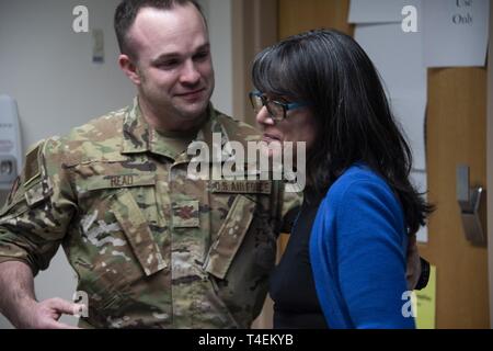 Air Force Maj. (Dr.) Matthew Read, acting Extracorporeal Membrane Oxygenation medical director, shares an emotional moment with former patient, Rita Ibanez, at Brooke Army Medical Center, Fort Sam Houston, Texas, March 22, 2019. Ibanez met with Read and other members of the ECMO team to thank them for the care she received in 2015. Stock Photo