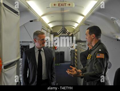 Japan (Mar. 29, 2019) — French Republic Ambassador to Japan Laurent Pic, left, speaks with Cmdr. Nathan Gammache, Patrol Squadron (VP) 47 Commanding Officer, right, during a static display tour of a P-8A Poseidon. The 'Golden Swordsmen' of VP-47 are currently deployed to Kadena Air Force Base in Okinawa, Japan conducting maritime patrol and reconnaissance and theater outreach operations within U.S. 7th Fleet (C7F) area of operations in support of Commander, Task Force 72, C7F, and U.S. Pacific Command objectives throughout the Indo-Asia Pacific region. Stock Photo