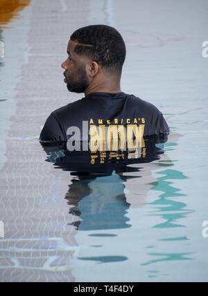 HEIGHTS, Mo. (April 6, 2019) Operations Specialist 1st Class Trenell Ewing, assigned to Navy Recruiting District (NRD) St. Louis, monitors students’ submersible robots during the USS St. Louis (LCS 19) SeaPerch Competition at Pattonville High School in Maryland Heights, Mo., April 6, 2019. SeaPerch is an innovative underwater robotics program and one of the science, technology, engineering and math (STEM) programs sponsored by the Office of Naval Research, which allows students to build and operate remote-controlled submersibles through various obstacle courses. NRD St. Louis' area of responsi Stock Photo