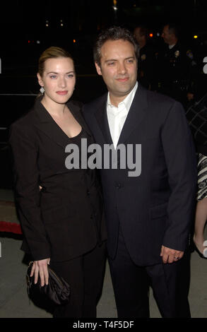 LOS ANGELES, CA. March 09, 2004: Actress KATE WINSLET & husband director SAM MENDES at the world premiere of her new movie Eternal Sunshine of the Spotless Mind, in Beverly Hills, CA. Stock Photo