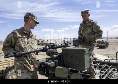 360th Chemical Company Soldiers change the barrel of an M2 machine gun while training during Operation Gauntlet, Mar. 31, 2019 at Fort Riley, Kansas. More than 450 Army Reserve Soldiers from around the country are participating in the three-week gunnery exercise for familiarization and increase battlefield lethality. Stock Photo