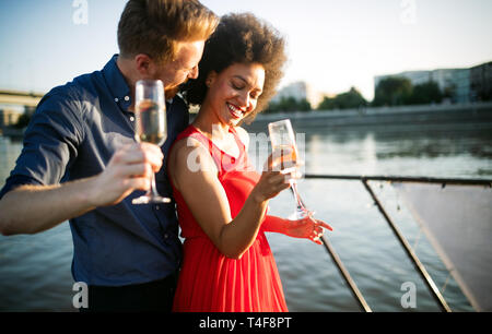 Romantic happy couples dancing and drinking at party Stock Photo