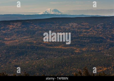 Mt Rainier seen from Mission ridge about 69 miles northeast during winter appears very large because of the relatively low lands surrounding the peak. Stock Photo