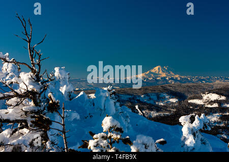 Mt Rainier seen from Mission ridge about 69 miles northeast during winter appears very large because of the relatively low lands surrounding the peak. Stock Photo