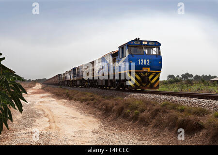 Rail & port operations for managing & transporting iron ore. Ore train on straightened and tampered rail track line curve - so cutting travel time. Stock Photo