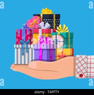 Gift boxes in hand. Colorful wrapped. Sale, shopping. Present boxes different sizes with bows and ribbons. Collection for birthday and holiday. Vector Stock Vector