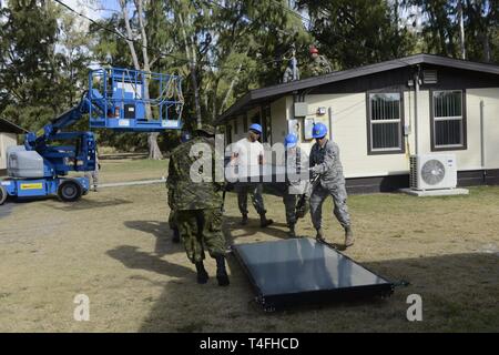 Airmen Of The 103rd Civil Engineer Squadron Remove Solar Panels