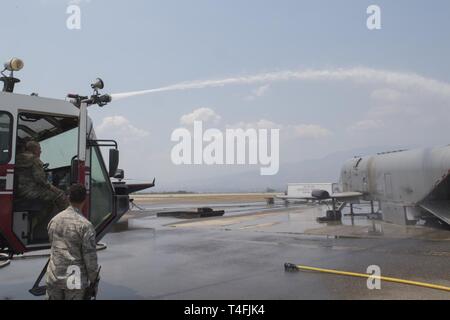 U.S. Air Force Maj. Gen. Andrew Croft, 12th Air Force commander, fires a water canon following a fire-extinguishing demonstration April 7, 2019, at Soto Cano Air Base, Honduras. Croft and Command Chief Master Sgt. John Storms, 12th AF command chief, visited members assigned to Joint Task Force – Bravo and 612th Air Base Squadron to host a town hall and meet with unit leadership. Stock Photo