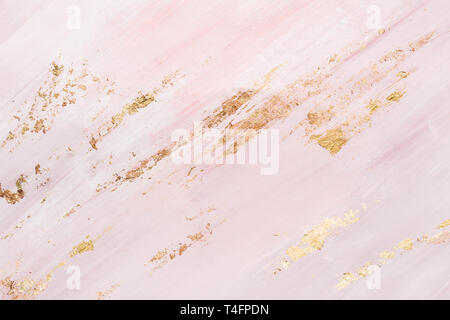 pink marble background with gold brushstrokes. Place for your design. Stock Photo