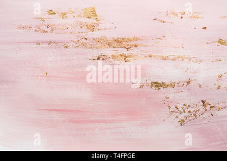 Delicate pink pattern marble pattern background. Golden accents and pink paint strokes. Stock Photo