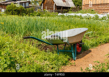cart for carrying cargo in the garden, Tool for gardening and home farming Stock Photo