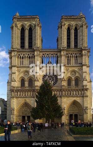 Notre Dame de Paris cathedral, France. Winter blue sky with some clouds. Front view. Past christmas photo. Stock Photo