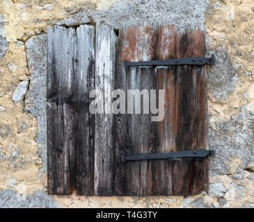 Very old, closed shutter Stock Photo