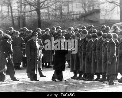 Minister of Defense Theodor Blank (M) presented on 13 January 1956 in Andernach the certificate of appointment to 450 new soldiers of the german Bundeswehr. | usage worldwide Stock Photo