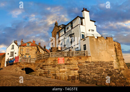 Bay Hotel & fishermans houses of the historic fishing village of Robin Hood's Bay, Near Whitby, North Yorkshire, England. Stock Photo