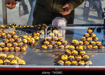 Turkish street food, roasting chestnut grill Stock Photo