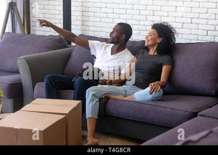 Happy African American couple planning renovation in new house Stock Photo