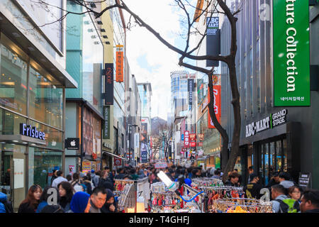 Seoul, South Korea - Mar 30, 2019: People walking down bustling Myeongdong street, one of the most popular tourists destination in Seoul. Stock Photo
