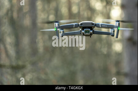 Gifhorn, Germany,March 6., 2019: The hobby drone Mavic 2 pro of a Chinese manufacturer flying in the forest, exempted by reduced depth of field Stock Photo