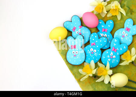 Easter bunny sugar cookies, adorable animal-shaped biscuits like a cute blue rabbits on white background Stock Photo