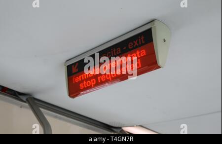 light signal with italian text FERMATA PRENOTATA that means Stop request in italian language on the tram of the italian  city Stock Photo
