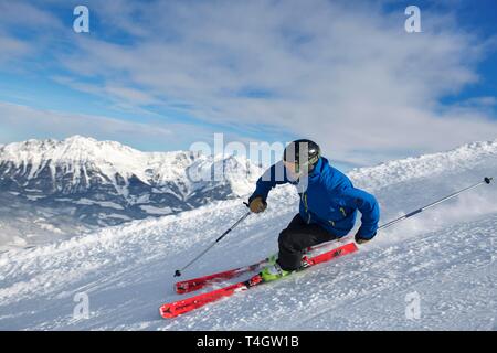 Young skier with sporty style of skiing at the descent from the Hohe Salve, Hopfgarten, Tyrol, Austria Stock Photo