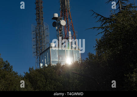 Communication towers, antennas and dishes over the mountain Stock Photo