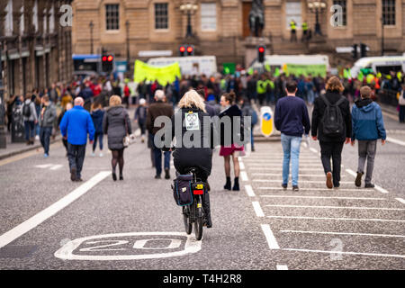 Edinburgh, UK. 16th April 2019. Protesters on North Bridge, Edinburgh, take part in the XR Climate Emergency Roadblock Demonstration. Stock Photo