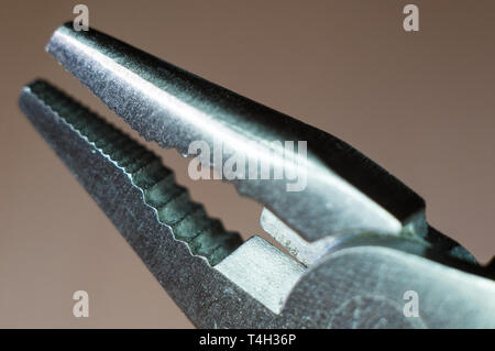 elements small foldable steel multitool, closeup, macro Stock Photo