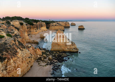 Amazing seascape at sunset at Marinha Beach in the Algarve, Portugal. Landscape with strong colors of one of the main holiday destinations in europe. 