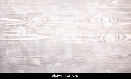 White slightly stained rustic wooden table background. Grunge style Stock Photo