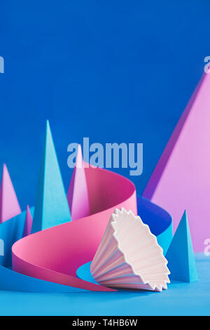 Ceramic origami dipper, pour-over coffee brewing equipment with paper shapes, pyramids, and curves. Stock Photo
