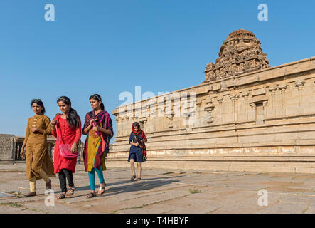 Group of women visit Vijaya Vitthala temple, Hampi, India Stock Photo