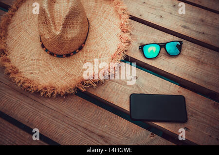 beach accessories on wooden board Stock Photo