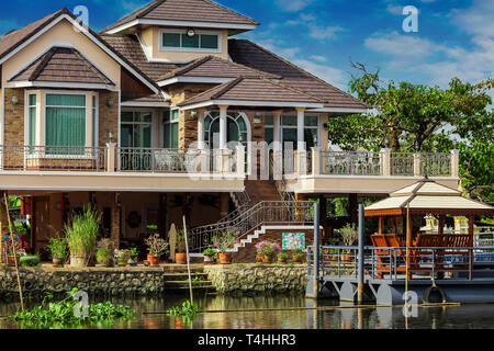 House on the river Nakhon Chai Si in Thailand Stock Photo